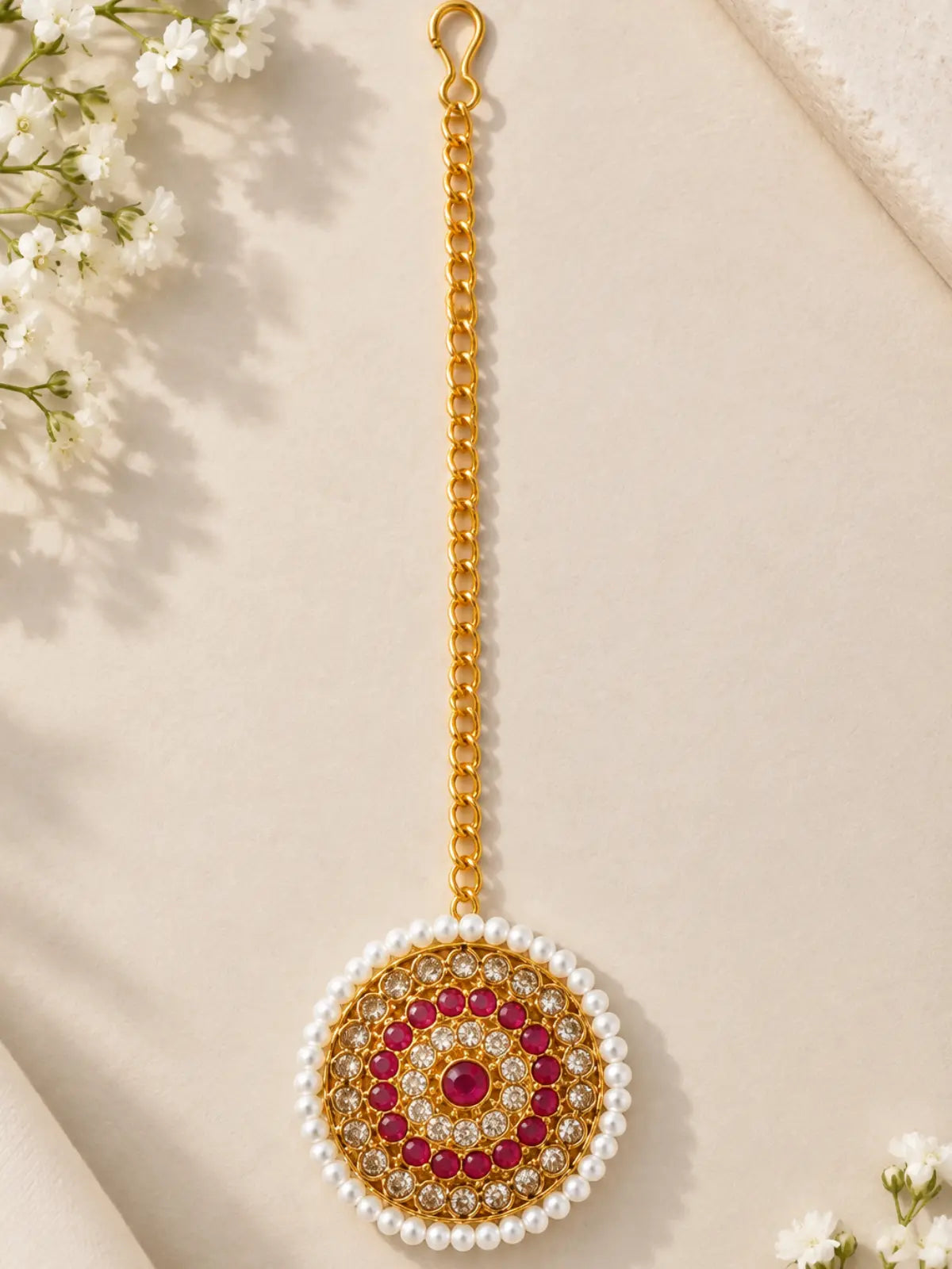Concentric circle bridal maang tika with pink stones and pearls