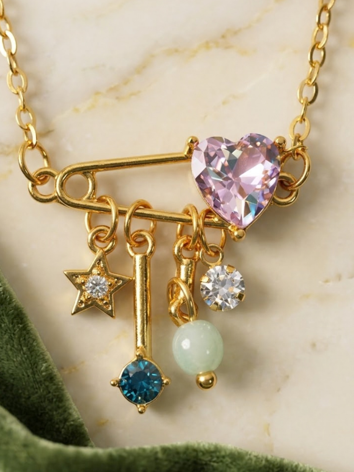 Gold charm necklace with star and crystal dangles