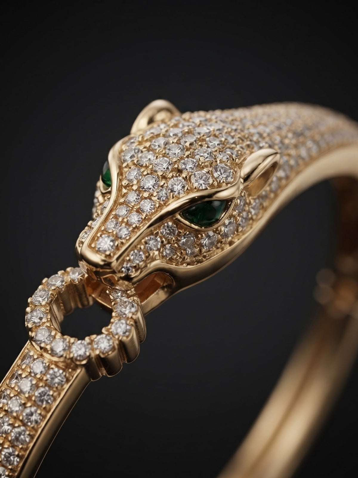 Luxury gold-tone panther bracelet with green eyes