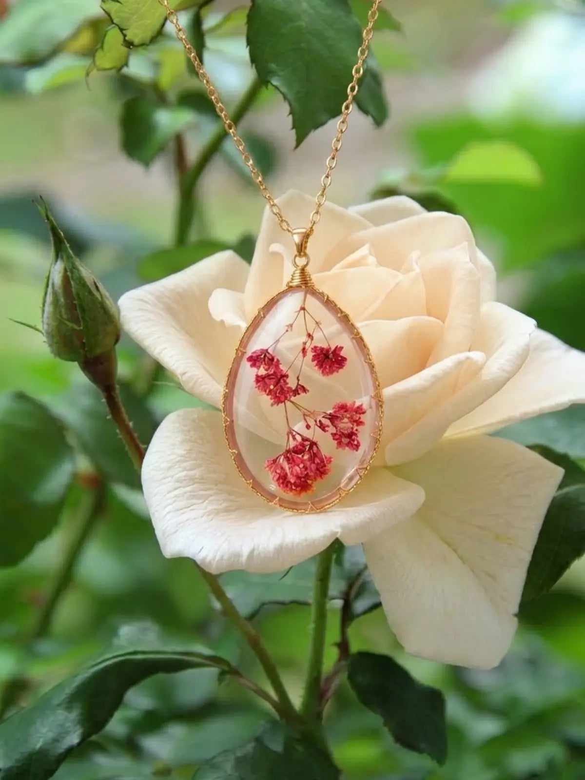 Real Baby’s Breath flower necklace with gold-tone pendant