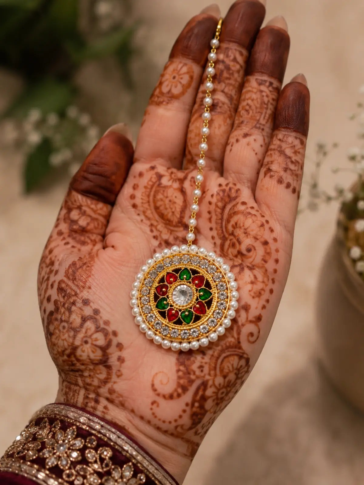 Red and green meenakari Borla jewellery for women