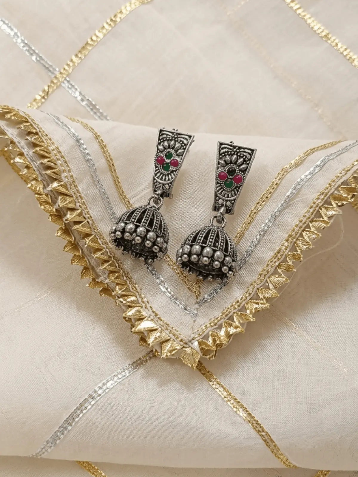 Stone Studded Oxidised Jhumka Earrings with Red & Green Gemstones